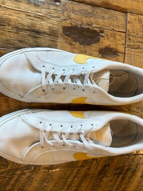 White Nike women’s Canvas Sneakers with Yellow Swoosh